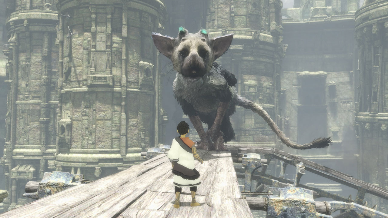 The boy and Trico share a moment in the ancient ruins