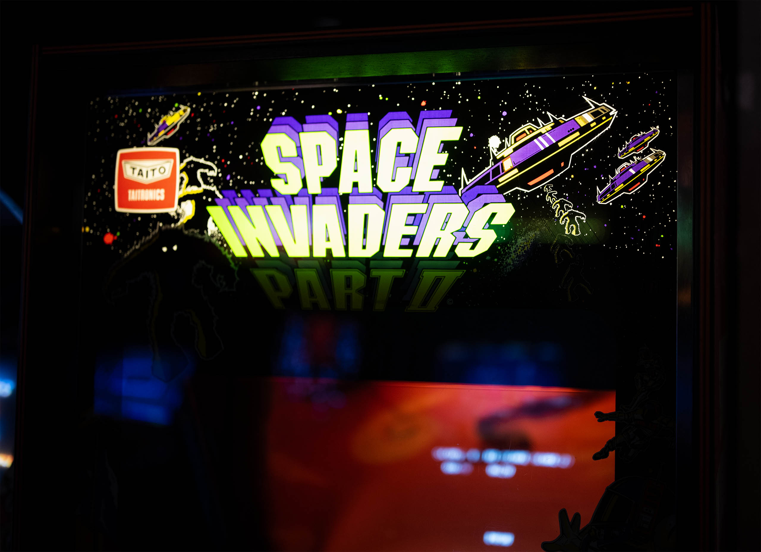 Space Invaders Part II arcade cabinet marquee with Taito logo